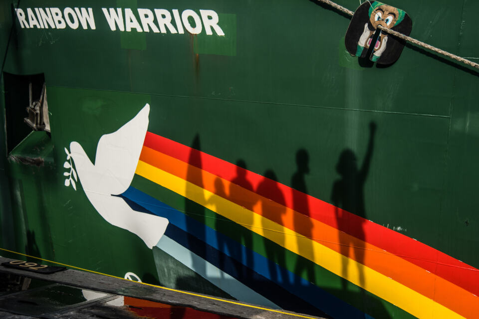  - The shadow of Members of They Lie We Die Community stand in front of The Greenpeace ship Rainbow Warrior at Tanjung Priok Port, Jakarta. The community allege the tobacco industry has lied to the public.